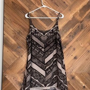 CAbi black and nude spaghetti-strap party top.